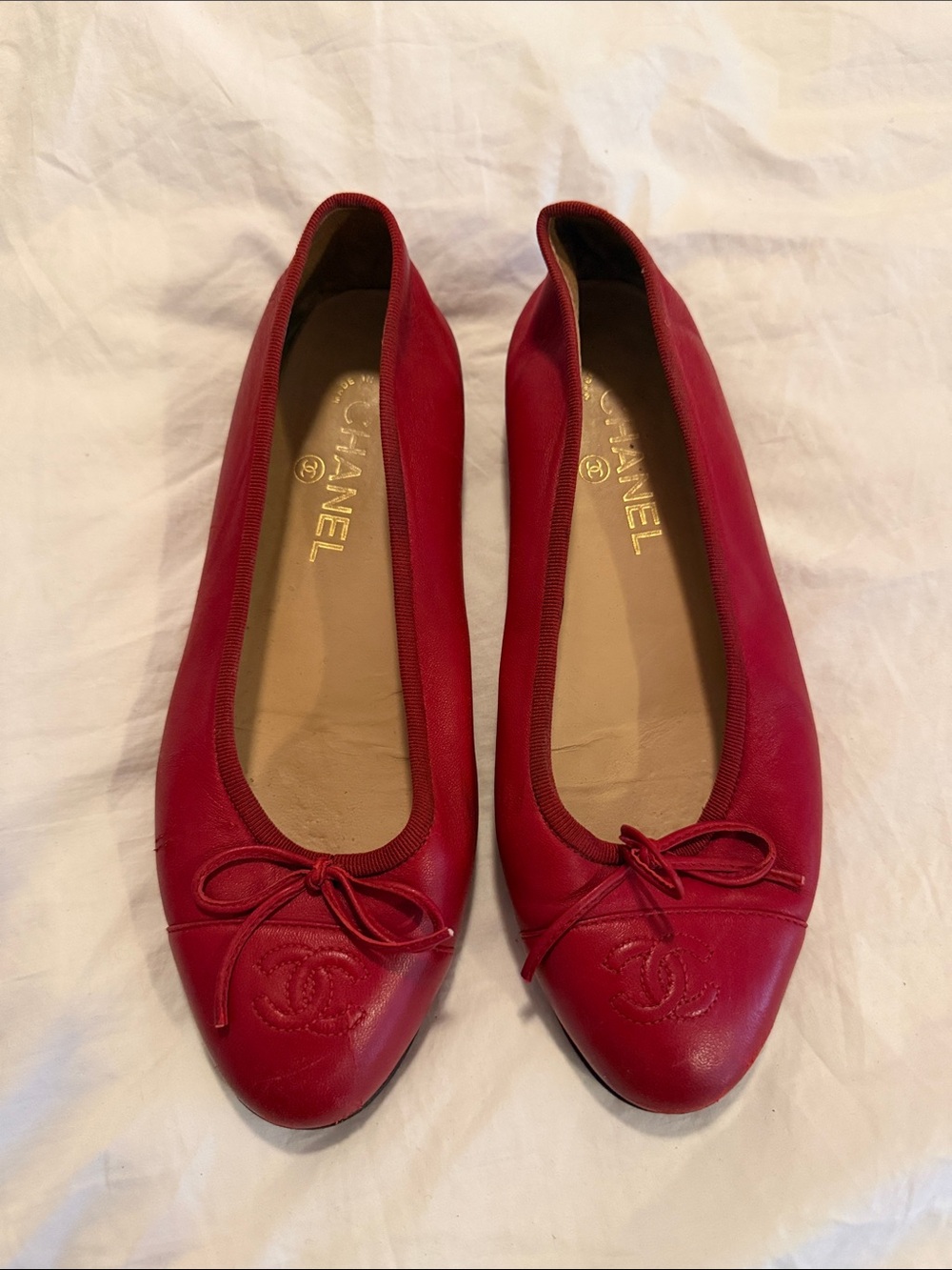 CHANEL Red Leather Ballet Flats with CC Toe Logo